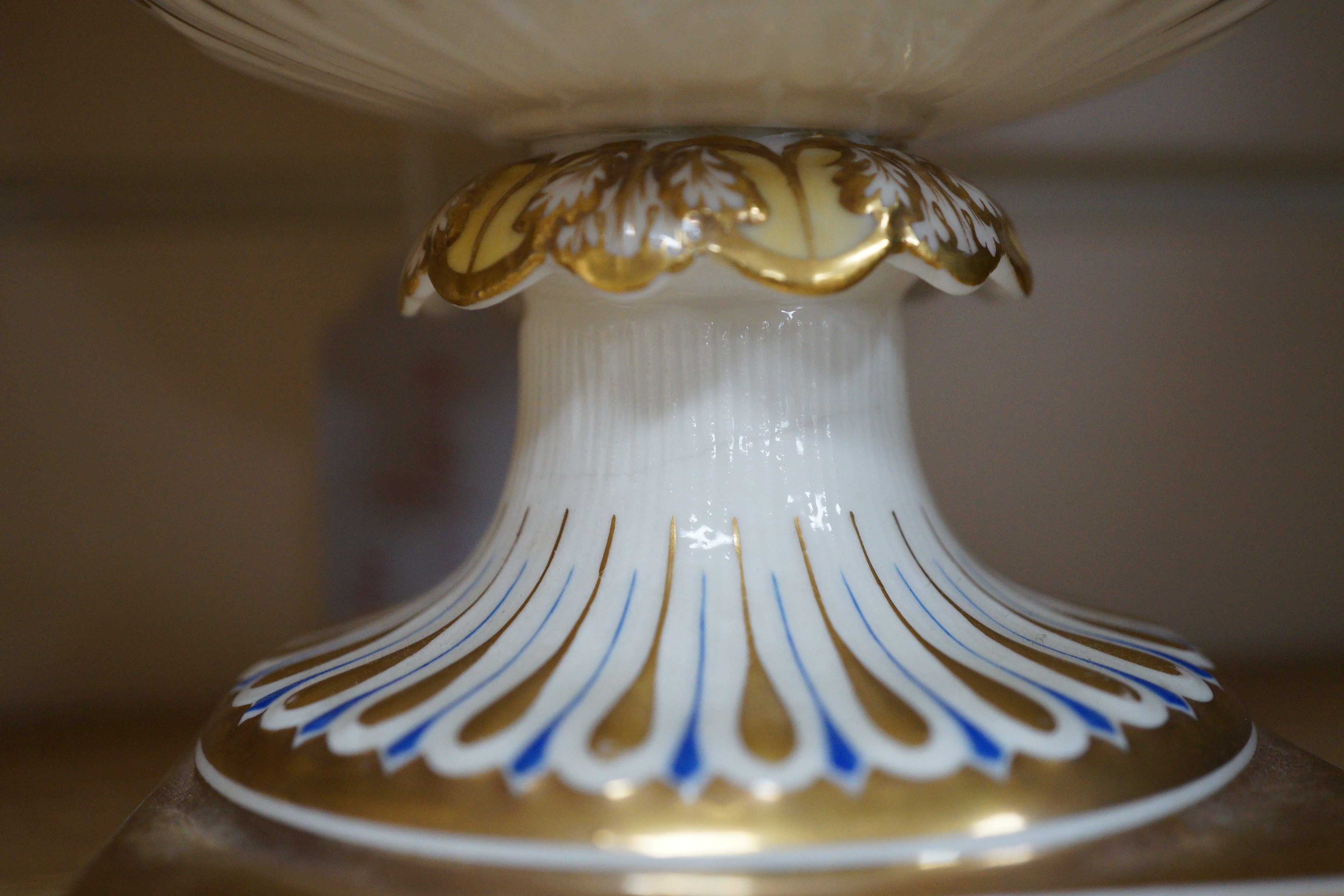 A pair of 19th century continental porcelain tazzas together with a smaller example and planter (4), tallest 19cm